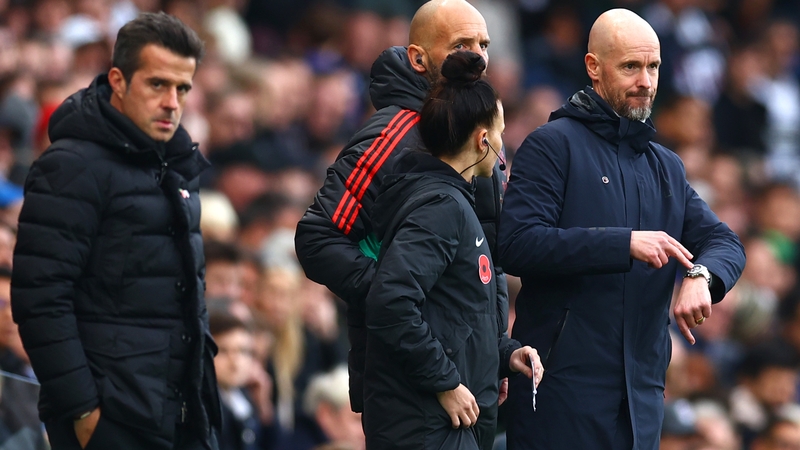 Erik ten Hag (R) gestures to his watch during Manchester United's win over Marco Silva's (L) Fulham