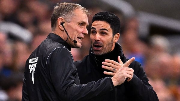 Mikel Arteta talks to fourth official Graham Scott at St. James' Park
