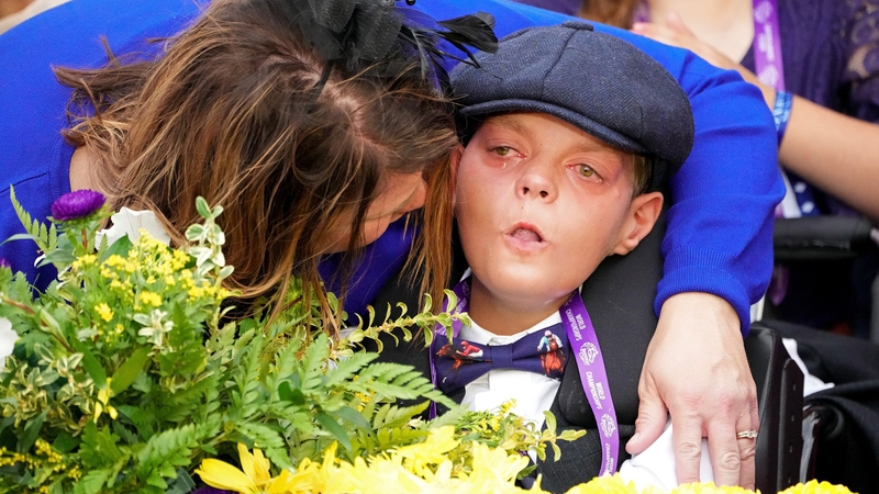 Cody Dorman is embraced by his mother Leslie after the win of Cody's Wish in last year's Breeders' Cup Dirt Mile