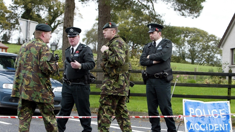 Police and soldiers seal off a road near Keady, in Co Armagh, after the death of Martin Conlon In 2005