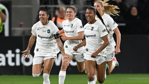 Farrelly (second left) and her team-mates celebrate their win