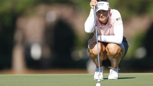 Emily Kristine Pedersen of Denmark lines up her putt on the 13th green