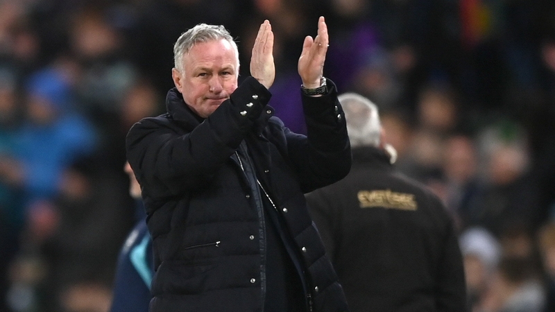 Northern Ireland manager Michael O'Neill applauds the supporters after the win over the Denmark