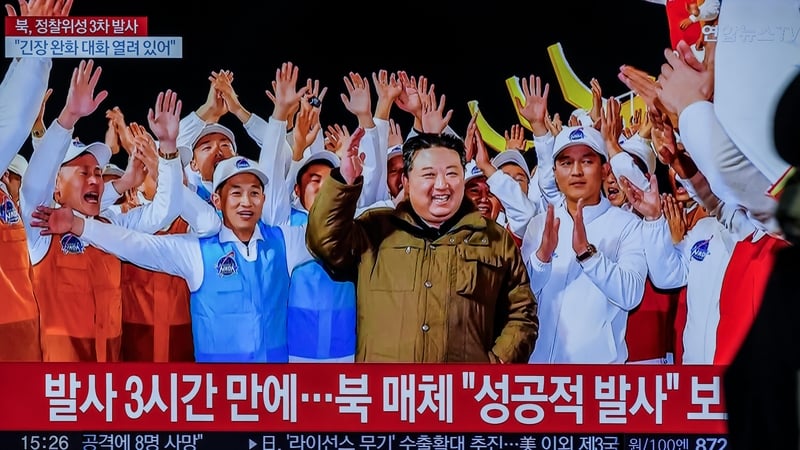 A TV at Seoul's Yongsan Station shows North Korean leader Kim Jong Un and a report that North Korea's spy satellite has entered orbit