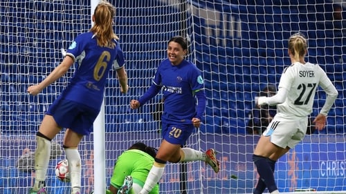 Sam Kerr celebrates the second of her three goals against Paris FC