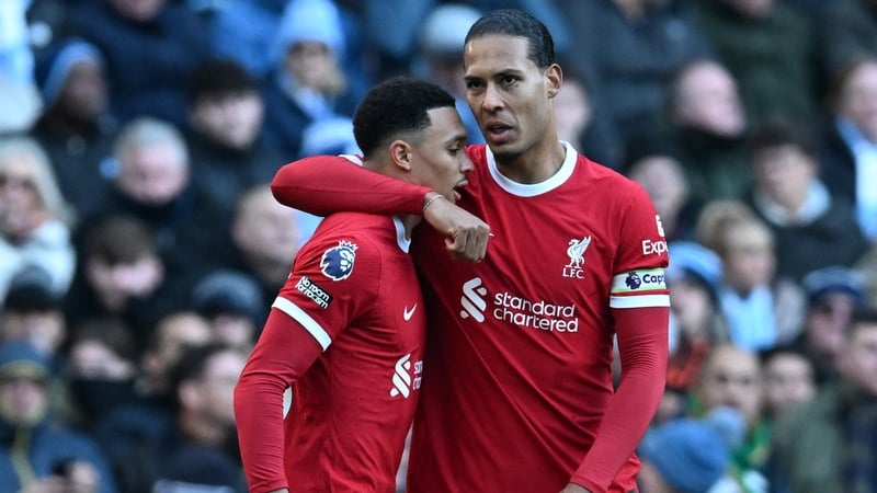Virgil van Dijk (R) congratulates Trent Alexander-Arnold after he scored for Liverpool against Manchester City