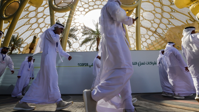 Participants arrive at the venue of the COP28 United Nations climate summit in Dubai