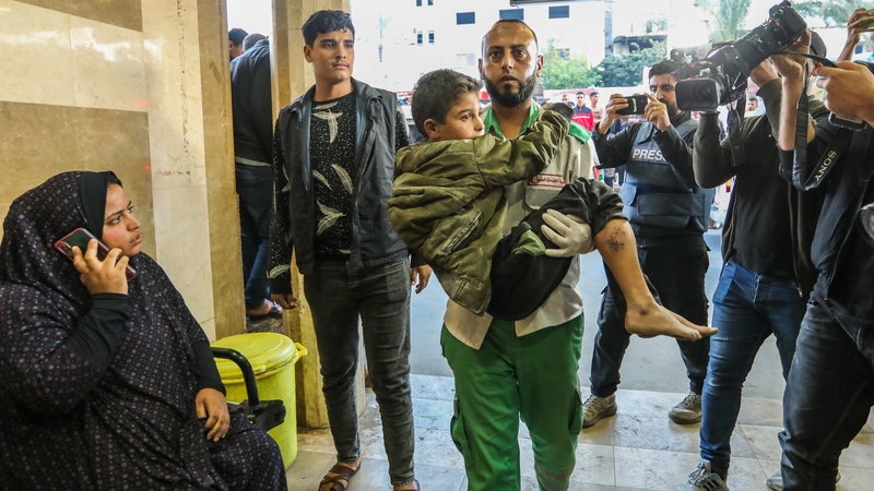 Palestinians injured in Israeli airstrikes arrive at Nasser Medical Hospital in Khan Yunis, Gaza