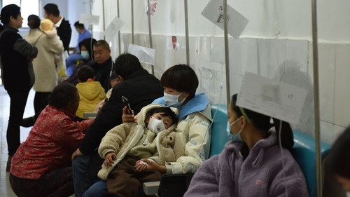 Sick children, accompanied by their parents, receive infusion treatment at the People's Hospital in Fuyang