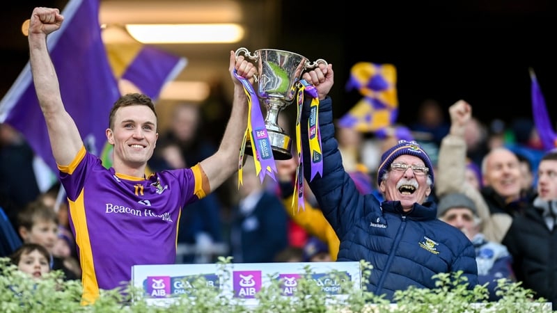 Kilmacud Crokes captain Shane Cunningham lifts the Sean McCabe Cup with kitman Vinny Patterson