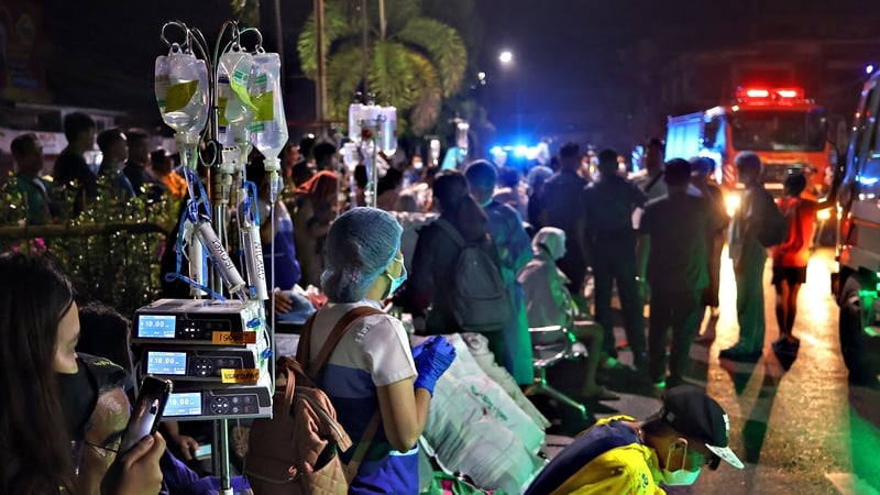 Patients being evacuated from a hospital after the quake struck
