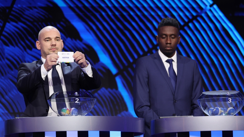 Wesley Sneijder pulls out the card of Austria during the EURO 2024 draw