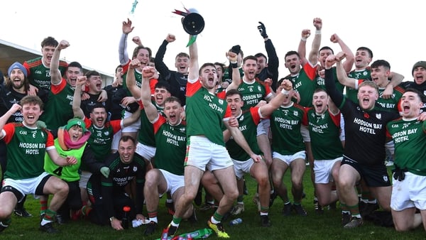 St Brigid's joint-captain Paul McGrath lifts the Shane McGettigan Cup