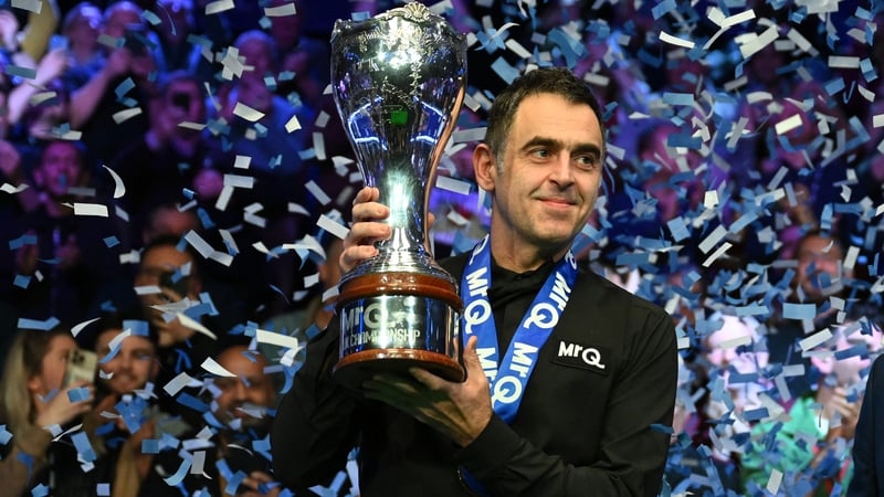 Ronnie O'Sullivan poses with the trophy after his victory over Ding Junhui