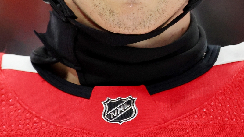 NHL player Wyatt Kaiser of the Chicago Blackhawks wears a neck guard last month