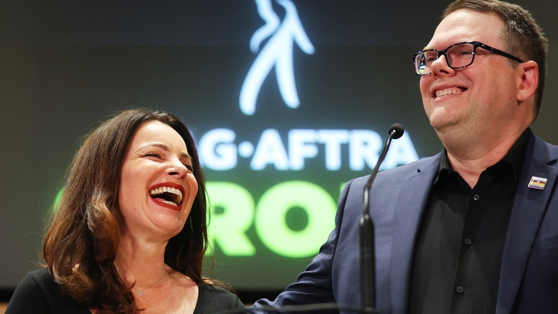 SAG-AFTRA President Fran Drescher and SAG-AFTRA National Executive Director Duncan Crabtree-Ireland at a press conference discussing the deal with the Hollywood studios on 10 November