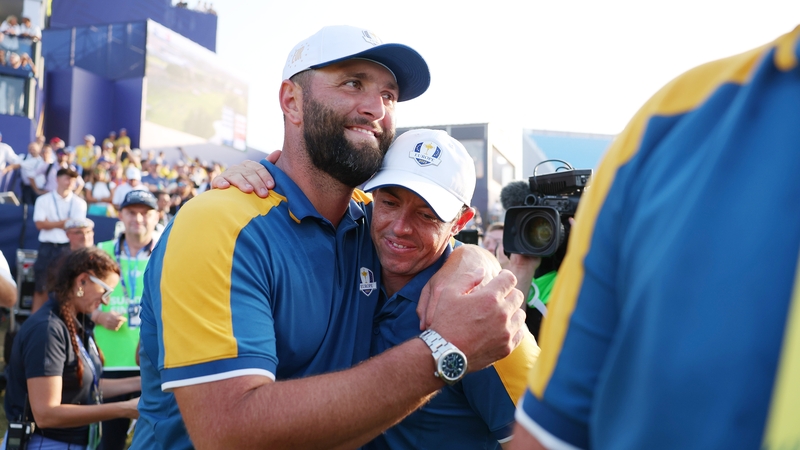 Jon Rahm (L) and Rory McIlroy celebrating Europe's Ryder Cup victory in 2023