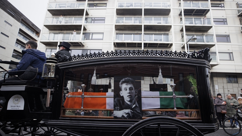 The funeral procession of Shane MacGowan makes its way along Pearse Street in Dublin