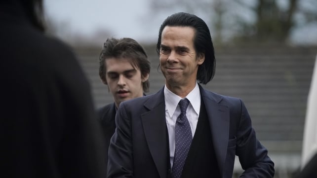 Singer-songwriter Nick Cave performed a version of The Pogues song 'A Rainy Night in Soho' at the funeral