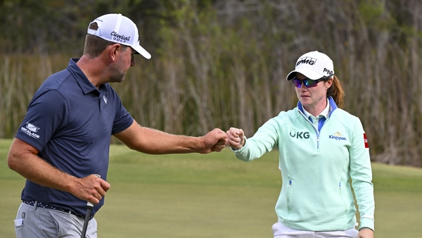 Leona Maguire with team-mate, Lucas Glover, at the ninth green during the first round
