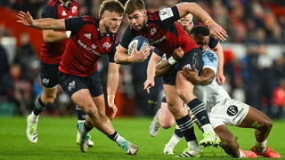 Munster's Jack Crowley is tackled by Riko Buliruarua of Bayonne