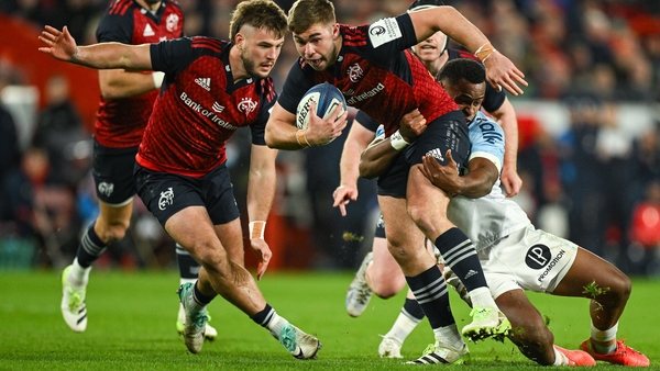 Munster's Jack Crowley is tackled by Riko Buliruarua of Bayonne