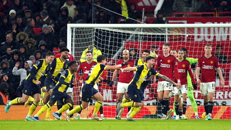Marcos Senesi (centre right) celebrates after scoring Bournemouth's third at Old Trafford