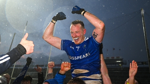 Damien Cahalane, who stood in goal for the shootout, is held aloft