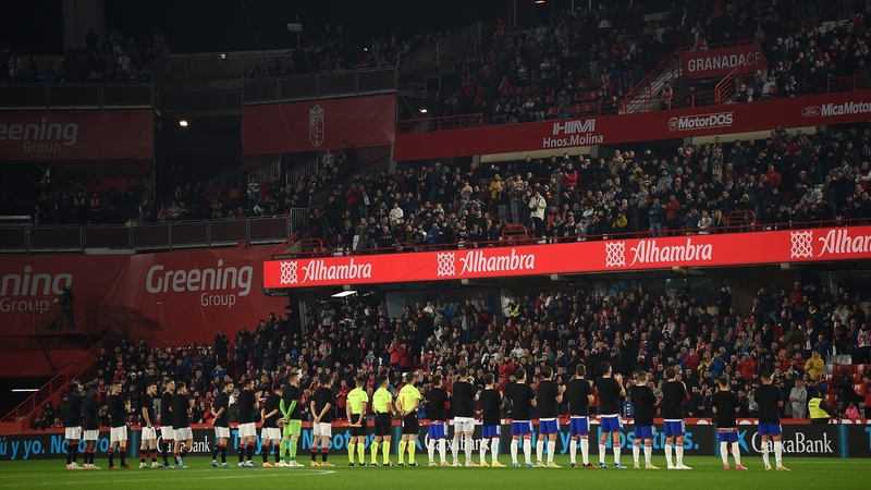 Granada and Athletic Bilbao players stand for a minute's silence to pay respect to late supporter Antonio Trujillo prior the La Liga match between at Nuevo Los Carmenes stadium