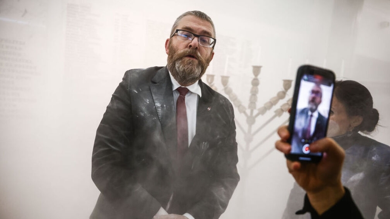 Grzegorz Braun seen after using the fire extinguisher in the Polish parliament lobby