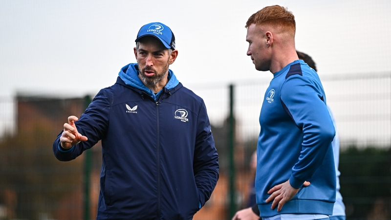 Leinster's attack coach Andrew Goodman (left) speaks to Ciarán Frawley