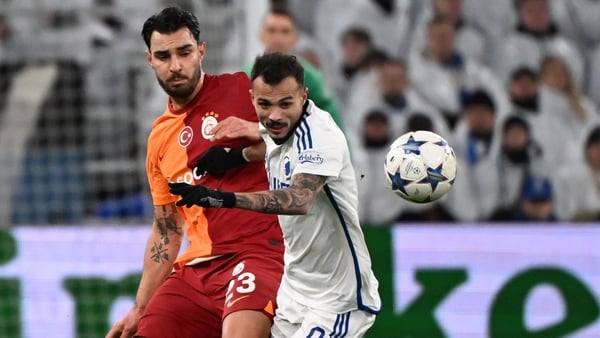 Kaan Ayhan (L) of Galatasaray in action against Copenhagen's Diogo Goncalves