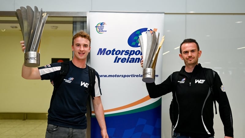 William Creighton, left, and his co-driver Liam Regan at Dublin Airport on their return home after the Junior world title win