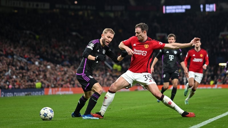 Jonny Evans tackles Konrad Laimer