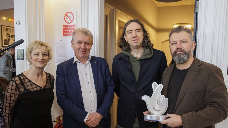 Gary Lightbody (second right) with Dr Paul Mullan (second left), Northern Ireland Director at The National Lottery and Open House founders Alison Gordon (left) and Kieran Gilmore (right) at Bangor Court House. Photo credit: Liam McBurney/PA Wire