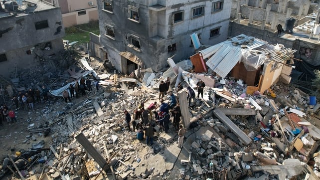 People search through the rubble of destroyed buildings as Israel continues its bombardment of Gaza following the 7 October attack by Hamas.