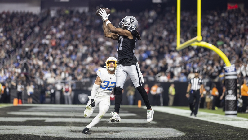 Davante Adams of the Las Vegas Raiders catches a touchdown pass from fellow wide receiver Jakobi Meyers