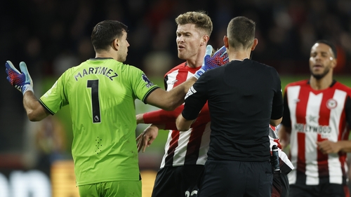 Ireland and Brentford defender Nathan Collins clashes with Aston Villa goalkeeper Emiliano Martinez