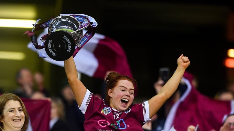 Dicksboro captain Jenny Clifford lifts the Bill & Agnes Carroll Cup after her side's victory