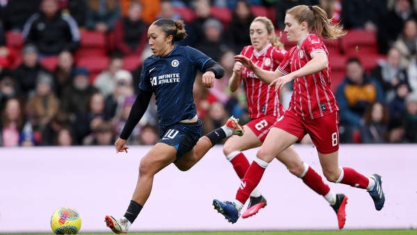 Chelsea's Lauren James runs with the ball as Amy Rodgers and Ireland international Megan Connolly (C) give chase
