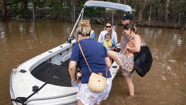 People prepare to return to their homes by boat in Cairns