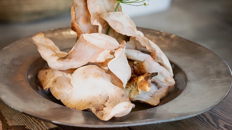 This thin and crisp flatbread is served with a range of extras, making it perfect for pre-dinner nibbles.