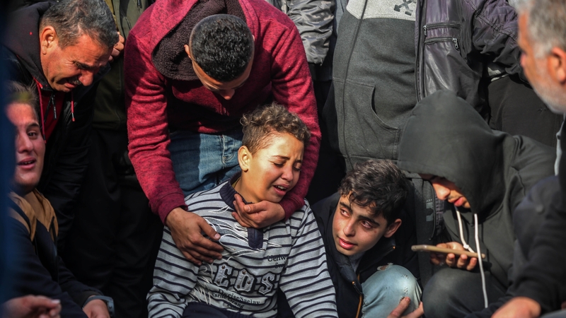 Palestinians mourn as they collect the bodies of family and friends killed in an Israeli airstrike on Khan Younis