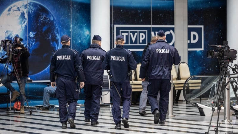 A group of police officers are seen entering the headquarters of Polish public media in the capital Warsaw
