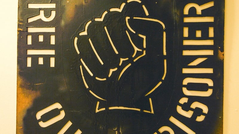 A UFF poster demands, 'Free Our Prisoners'