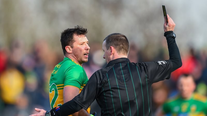 Joe McQuillan issues a black card to Paul Brennan