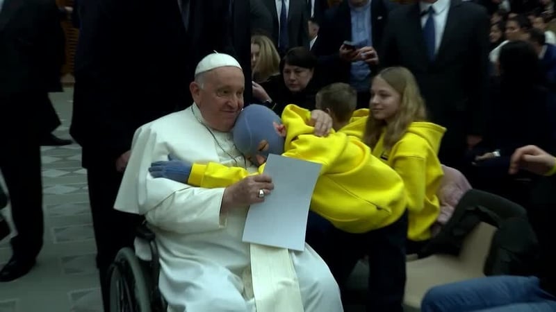 Roman Oleksiv hugging Pope Francis in the Vatican earlier this month