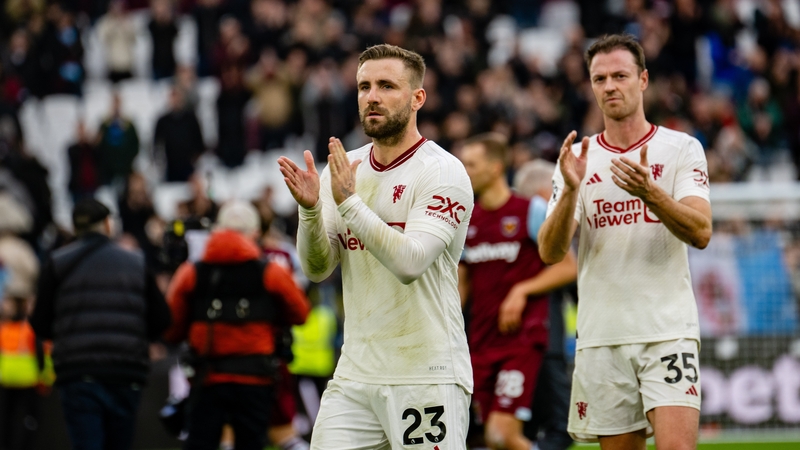 Luke Shaw (L) applauds the travelling Man United fans after the loss to West Ham