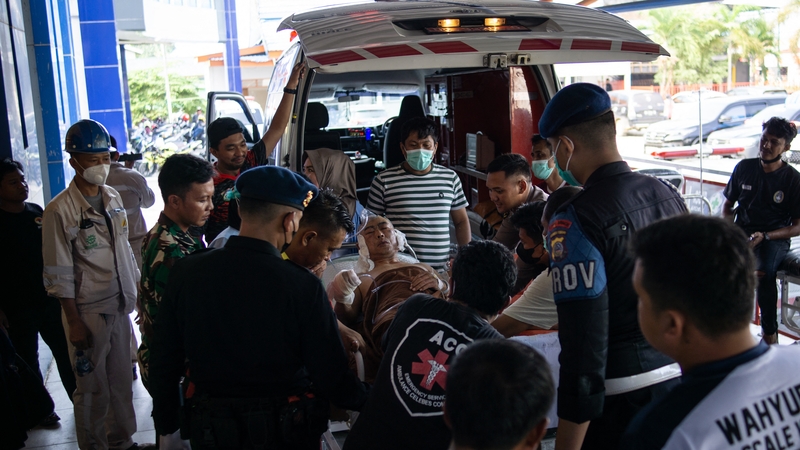 A Chinese worker who was injured in the explosion at a nickel smelter furnace is brought to the Morowali Regional General Hospital in Central Sulawesi