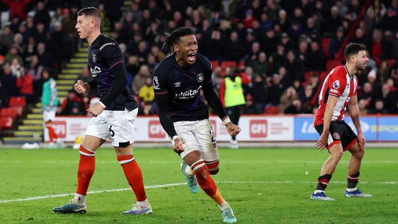 Luton Town's Gabriel Osho celebrates as Jack Robinson (not pictured) scores an own goal